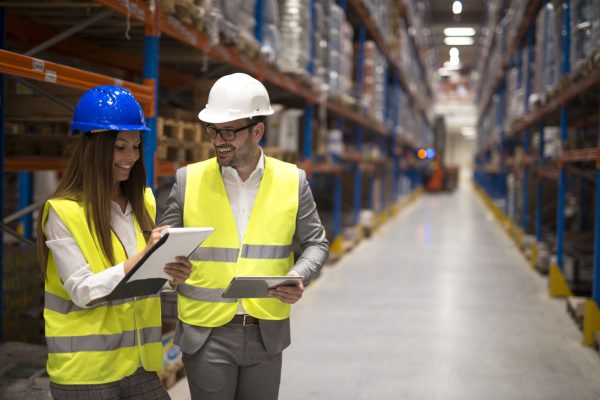 warehouse-managers-sharing-ideas-consulting-each-other-about-organization-distribution-goods